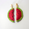 Handwoven Watermelon slice earrings on a white background