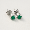 Sterling silver 925 claw setting holding natural Colombian emerald stud earrings from Muzo Boyacá Colombia