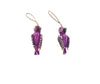 Two purple parrot-shaped bird charms