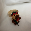 Napkin ring decorated with small handwoven capybara.